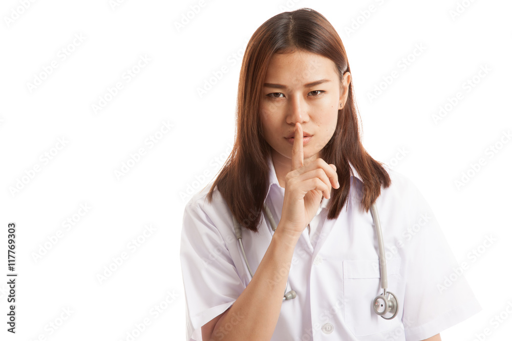 Asian young female doctor do quiet sign. Asian young female doctor do quiet sign.