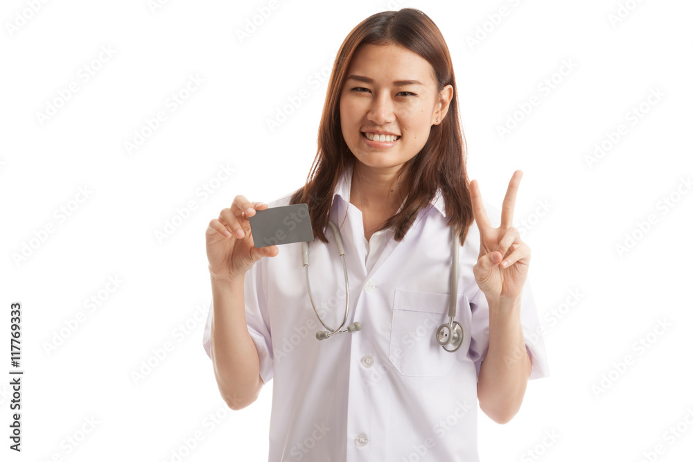 Asian young female doctor show victory sign with blank card. Asian young female doctor show victory sign with blank card.