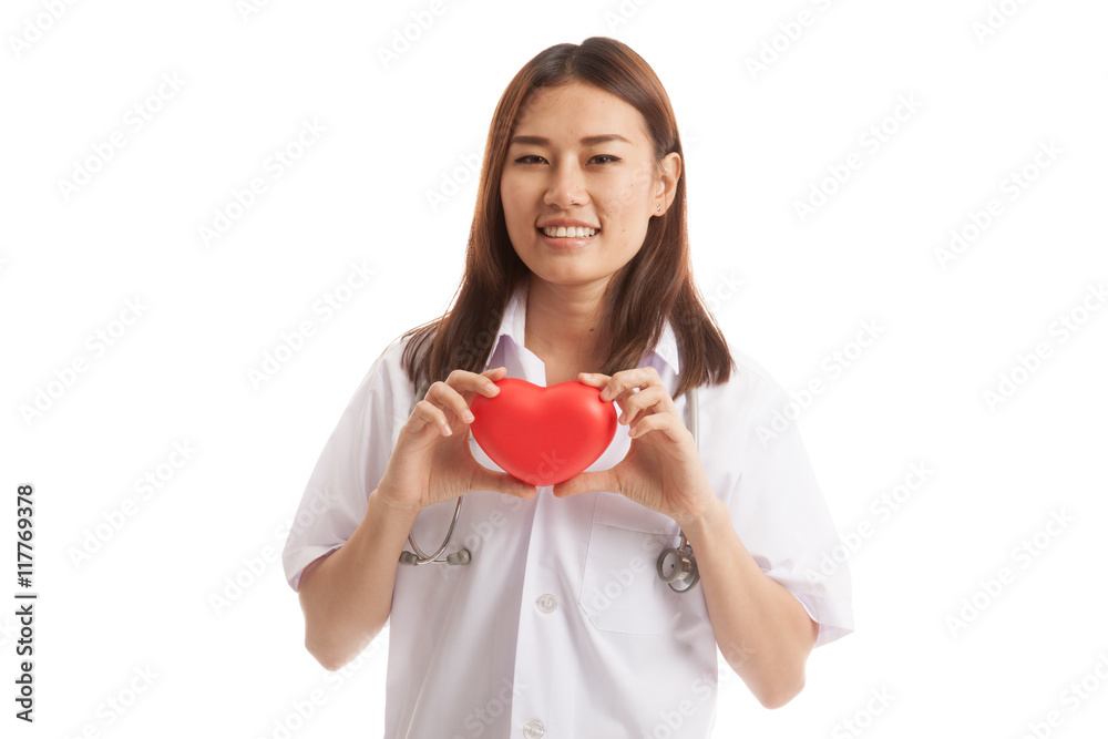Asian young female doctor hold a red heart. Asian young female doctor hold a red heart.