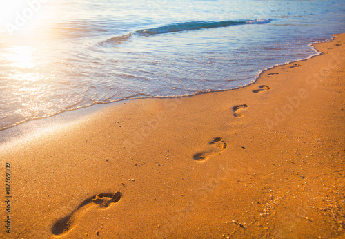 beach, wave and footprints