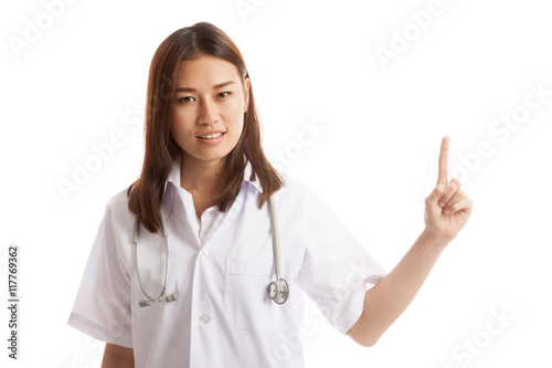 Asian young female doctor point to blank space.