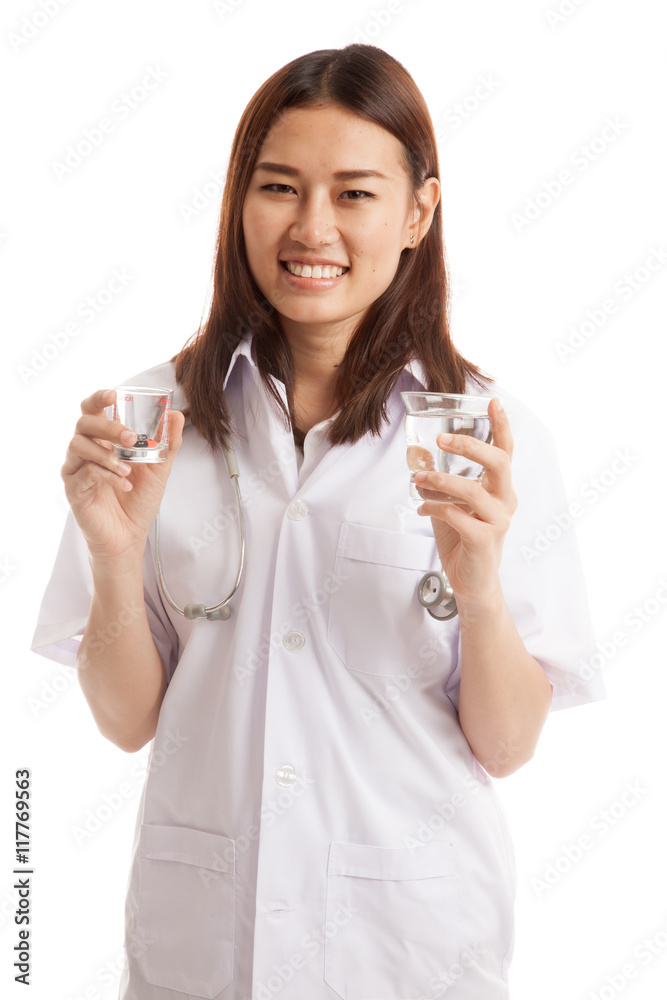 Young Asian female doctor with water and medicine. Young Asian female doctor with water and medicine.