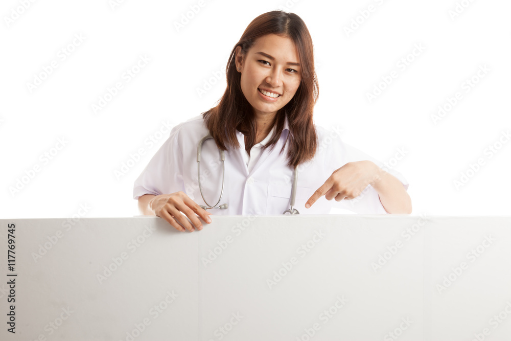 Young Asian female doctor point down to blank sign. Young Asian female doctor point down to blank sign.