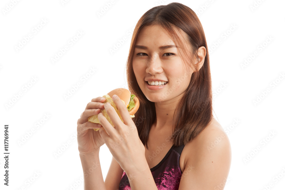 Beautiful Asian healthy girl enjoy eating hamburger. Beautiful Asian healthy girl enjoy eating hamburger.