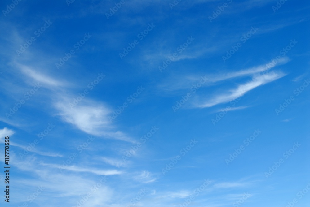 white fluffy clouds on blue sky
