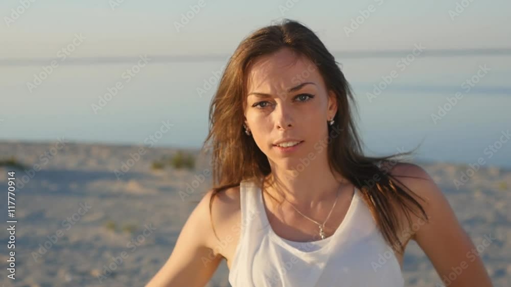 girl at sea background in slow motion. girl waves a head, hair flying girl at sea background in slow motion. girl waves a head, hair flying