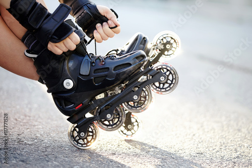 Setting of laces on roller skates photo