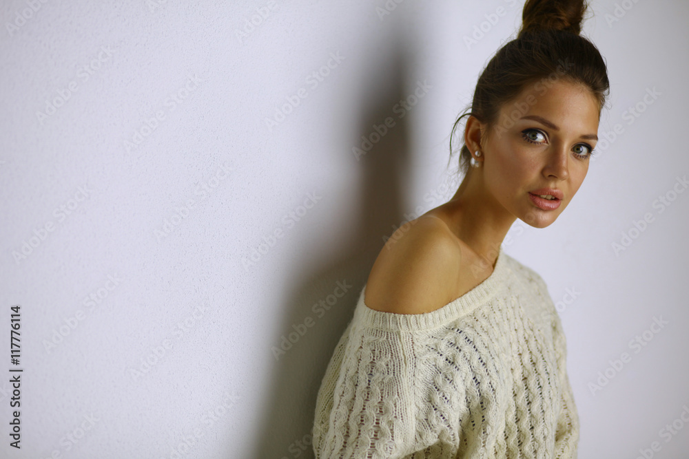 Portrait of a cute woman in sweater at home Portrait of a cute woman in sweater at home