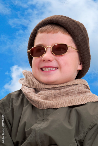 Boy in Winter Clothing Enjoying the Sunshine photo