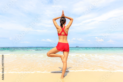 yoga woman on sea coast © pigprox