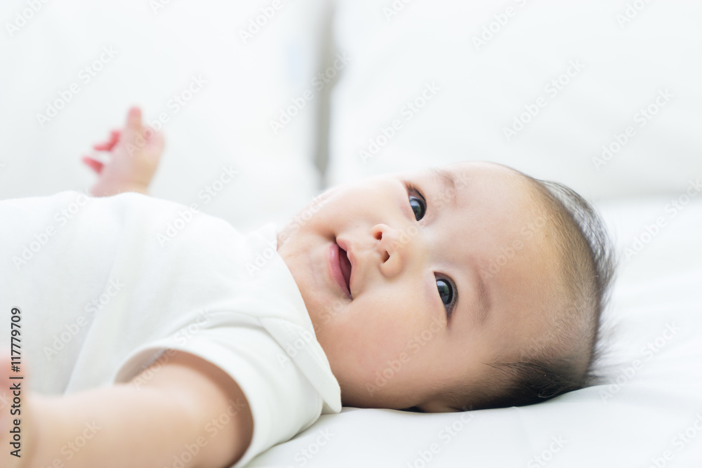 Portrait of a newborn Asian baby on the bed Portrait of a newborn Asian baby on the bed