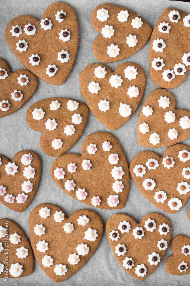 Heart shaped cookies on baking paper background