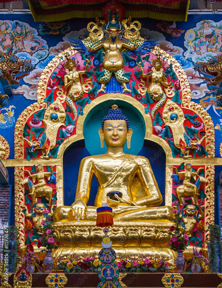 Golden statue of Gautam Buddha in Namdroling Monastery in Bylakuppe, Karnataka, India.
