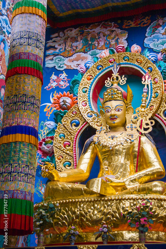 Golden statue of Padmasambhava in Namdroling Monastery in Bylakuppe, Karnataka, India.