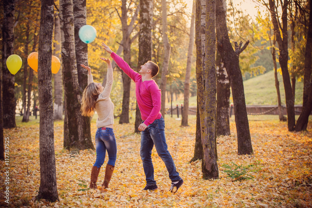 Fototapeta premium young couple in autumn park