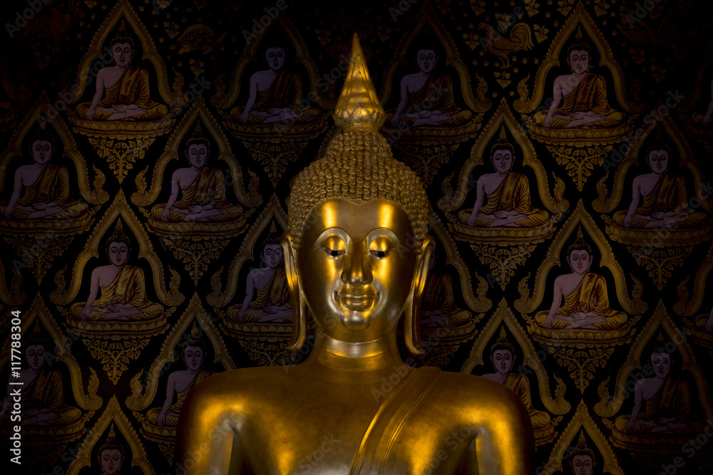 A beautiful golden Buddha statue in a temple in Nan province, Thailand