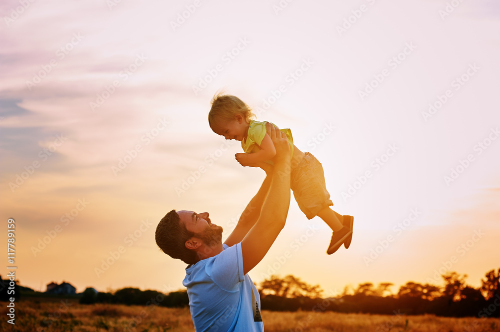 Happy family. Father and son playing outdoors. The concept of father's day