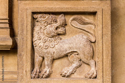 A carving of a lion at the Buddhist temple of Kelaniya, Sri Lanka. photo