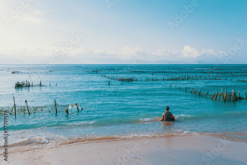 Dream beach, Algae at low tide and boy