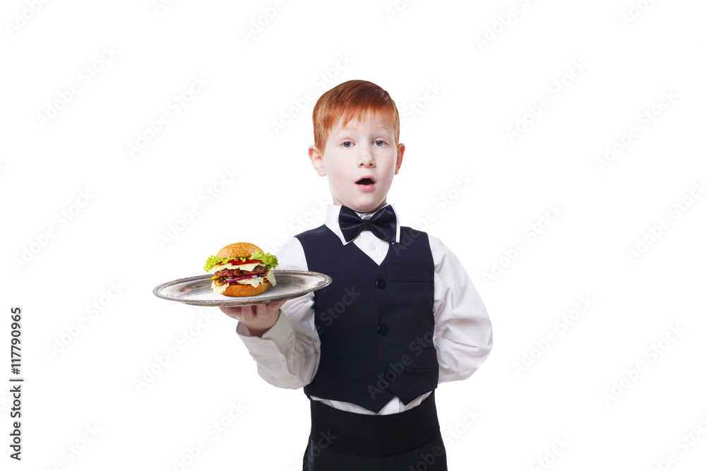 Little surprised boy waiter stands with tray serving hamburger Little surprised boy waiter stands with tray serving hamburger
