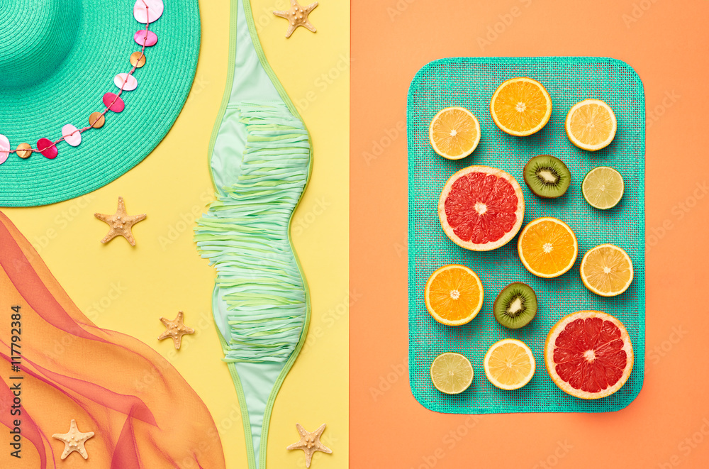Naklejka premium Fashion. Bright Summer Color. Fashion clothes Accessories set. Tropical Fruit Creative Art concept. Citrus, Orange, Grapefruit Lime Kiwi. Fashion woman Swimsuit. Stylish girl. Minimal. Top View