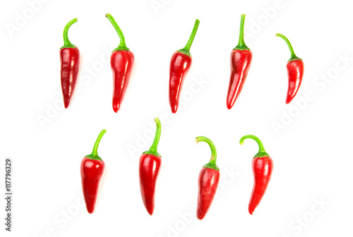 Many ripe red  Chilli peppers on white