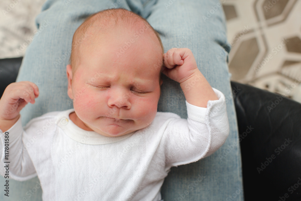 Cute newborn baby lying on mother lap Cute newborn baby lying on mother lap