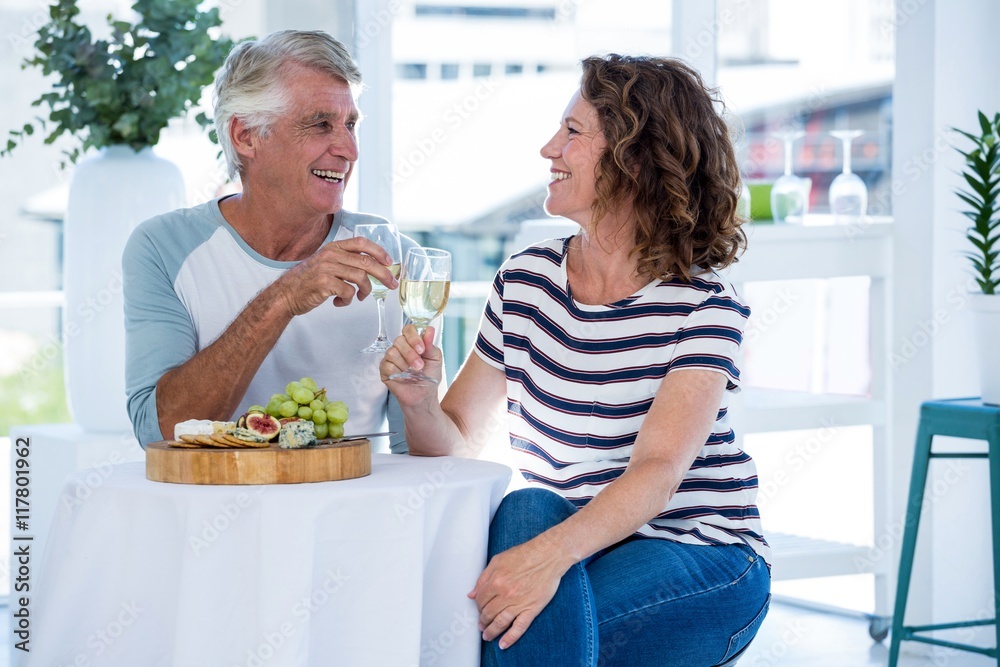Couple toasting champagne at restaurant