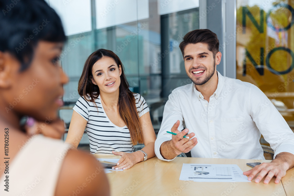 Business partners discussing ideas at meeting in office
