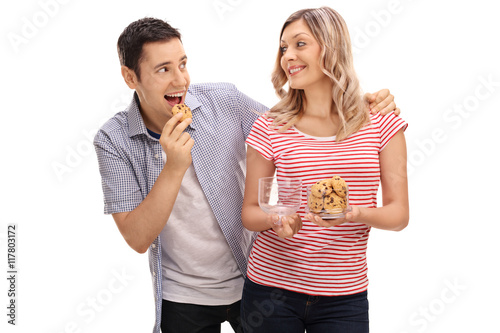 Fotografie Young man sneaking up on his girlfriend