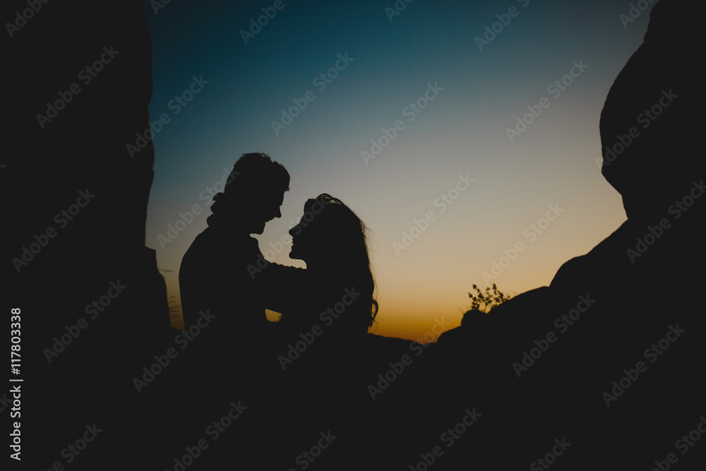 Embracing couple in twilight