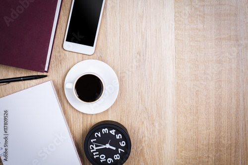 Coffee, smartphone, clock and supplies