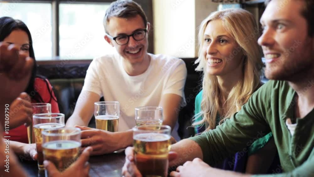 happy friends drinking beer at bar or pub happy friends drinking beer at bar or pub
