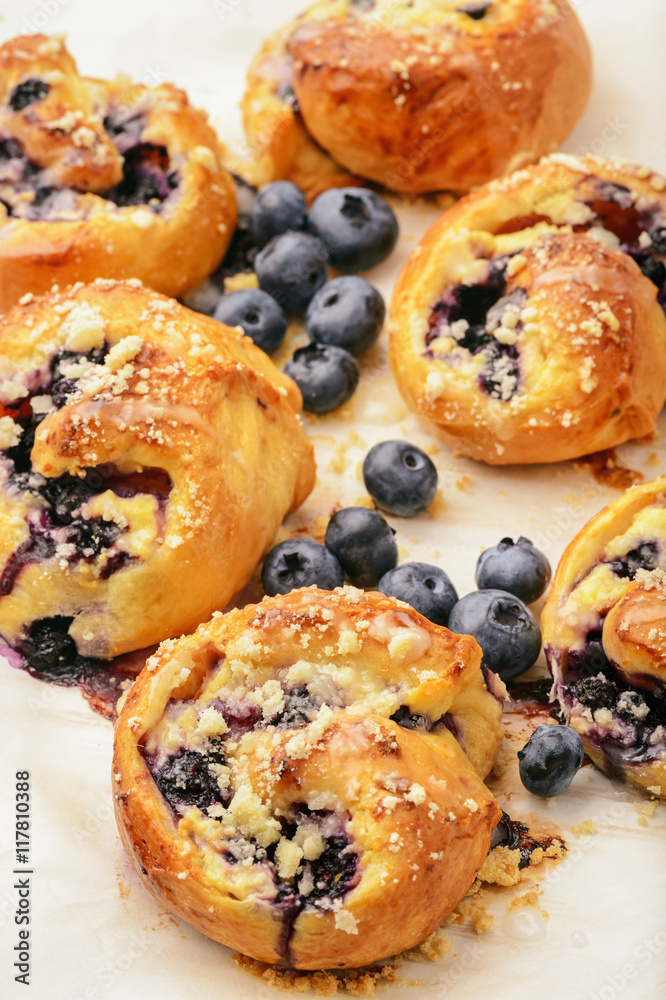 Fresh yeast buns with cheese and blueberries.