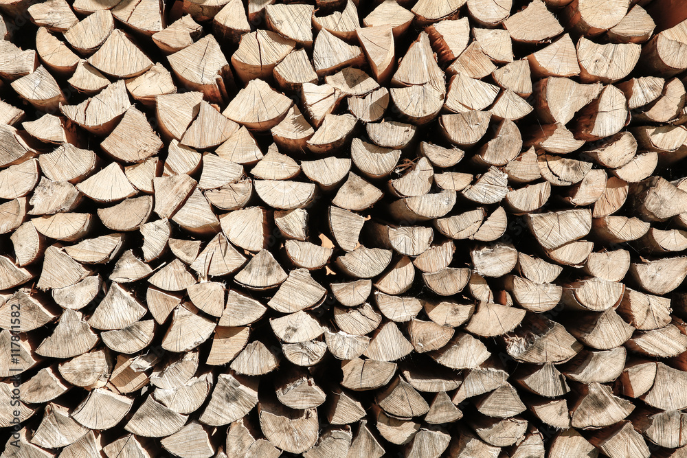 Neat stack of cut wood, textured background
