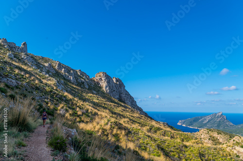 Female hiking in the mountains of Tramuntana, Mallorca, Baleares, Spain