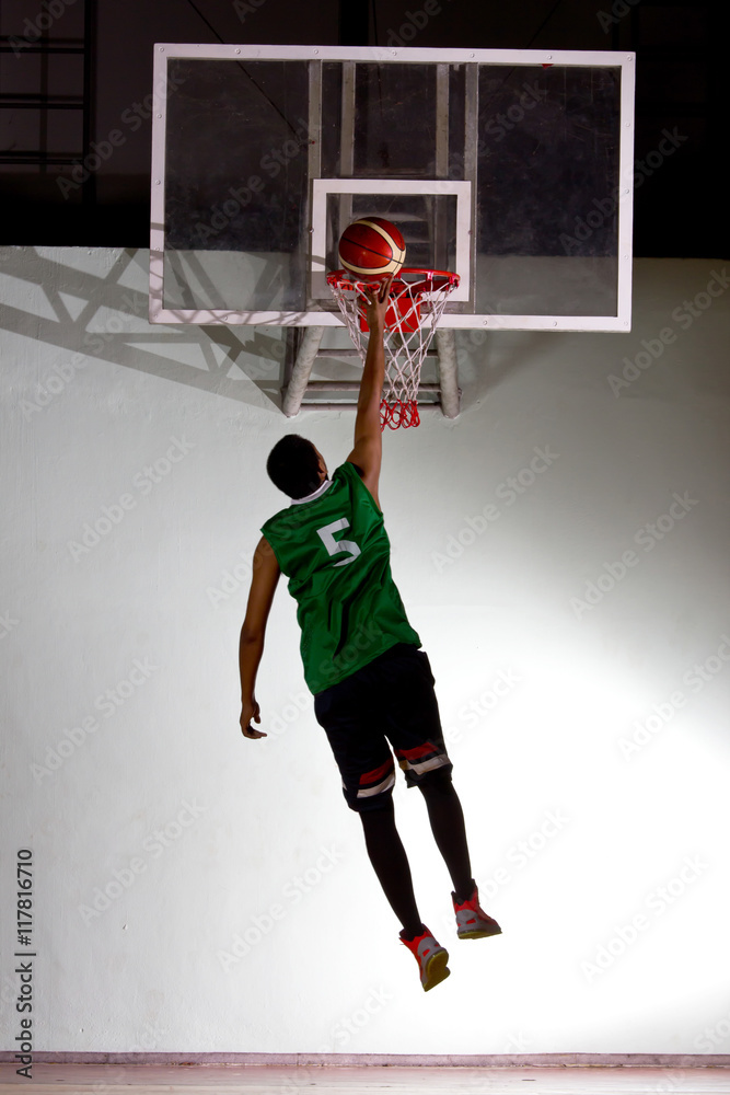 Basketball player jump for shooting ball