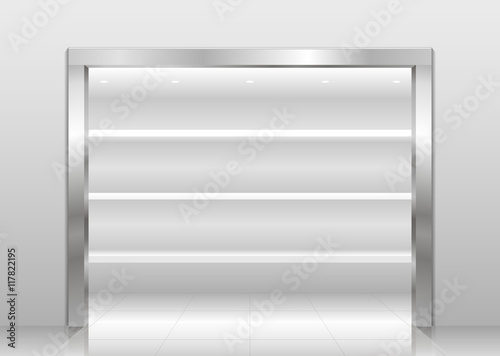 Exhibition showcase interior store in a niche with a steel or chrome-plated metal portal. White Wardrobe shelves