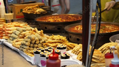 Seoul, Korea variety of Korean street food stall, tteokbokki, fish hotdog, sausage and other fried food on stick