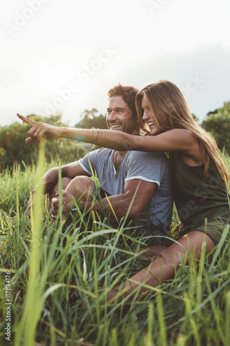 Attractive couple together on meadow