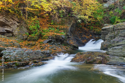 Autumn Landscape with a mountain river and waterfalls