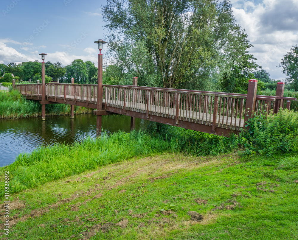 wooden bridge with lanterns at the park wooden bridge with lanterns at the park