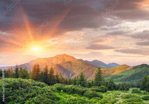 Summer landscape with a beautiful sunrise in the mountains