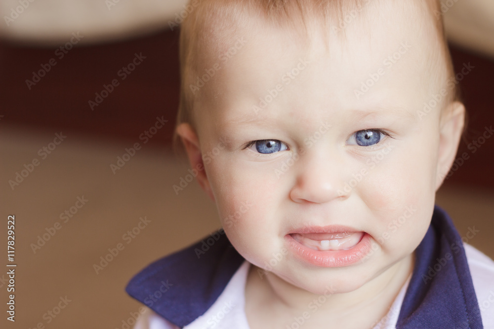 Angry boy with two teeth is about to cry Angry boy with two teeth is about to cry