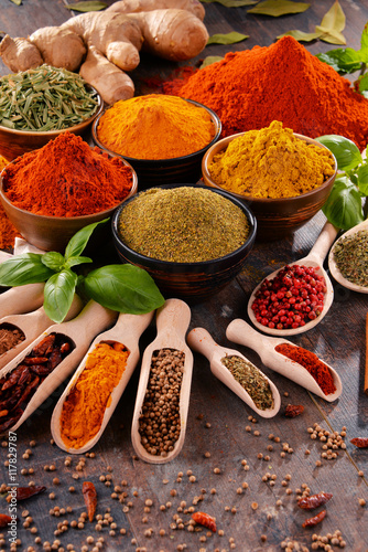 Fototapeta Naklejka Na Ścianę i Meble -  Variety of spices on kitchen table