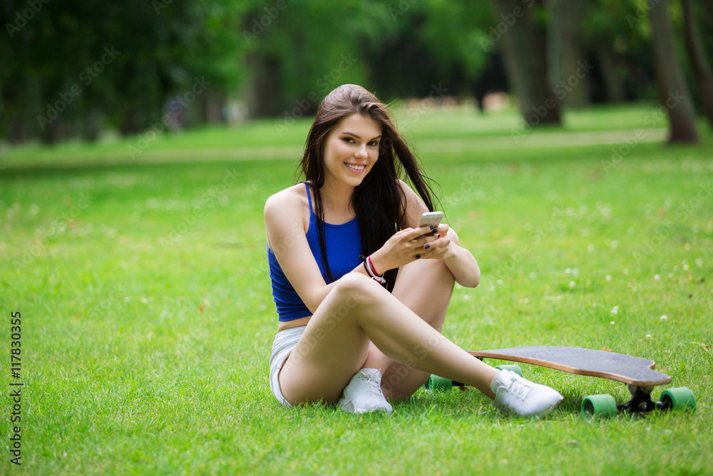 Happy girl relaxing at the park Happy girl relaxing at the park