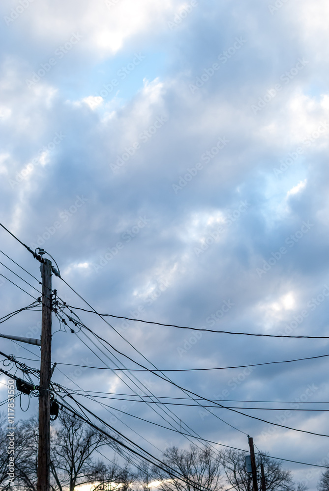 custom made wallpaper toronto digitalBeautiful clouds after rainy storm. Storm clouds. Sun breaking through cloudy skies. Electricity pole. Electric lines. Urban design.