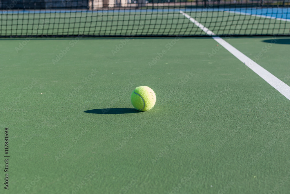Abstract image of tennis court and tennis equipment. Light and shadow on tennis court. Daylight on a tennis court. Outdoors sport. Minimal art and design. 
