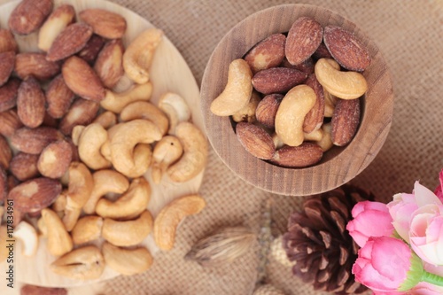 Almonds and cashew is delicious on wood background.