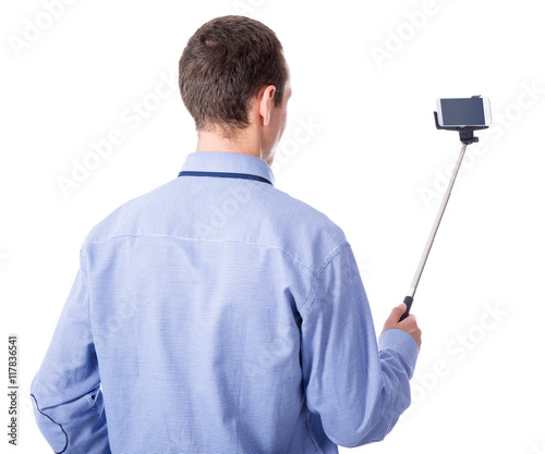 young business man taking selfie photo with smart phone on selfi